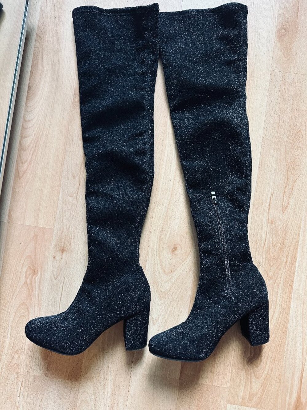 Above the knee, black, festive, sparkling canvas tall boots.